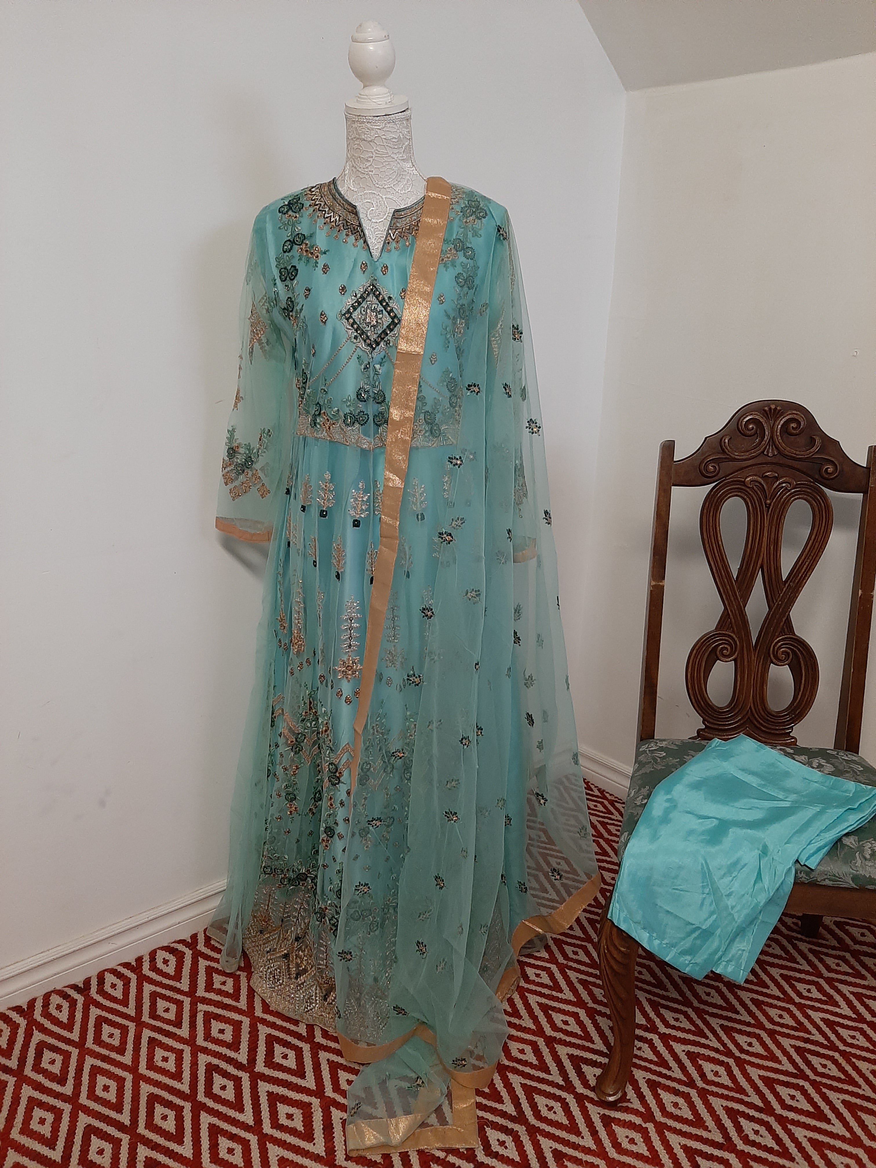 Turquoise Dual Tone Sheer Gown Design by Gauri And Nainika at Pernia's Pop  Up Shop 2024
